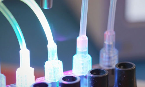 Fumes or smoke emitted during cure of light-curable adhesive